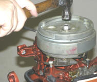 Remove the Flywheel - There are two ways to remove the flywheel, depending on the tools you have.  Most mechanics will recommend that you use a flywheel puller.  You can rent a steering wheel puller from your local tool rental shop or you can buy a harmonic balancer.   Using a puller is the safest way to prevent bending or warping the flywheel.  You want a puller that attaches to the three bolt holes in the flywheel to remove it.  Do not use a puller that pulls up on the outer edge of the flywheel.