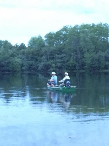 Tom Travis and Uncle Curt Barrett flyfishing in newly restored boat.